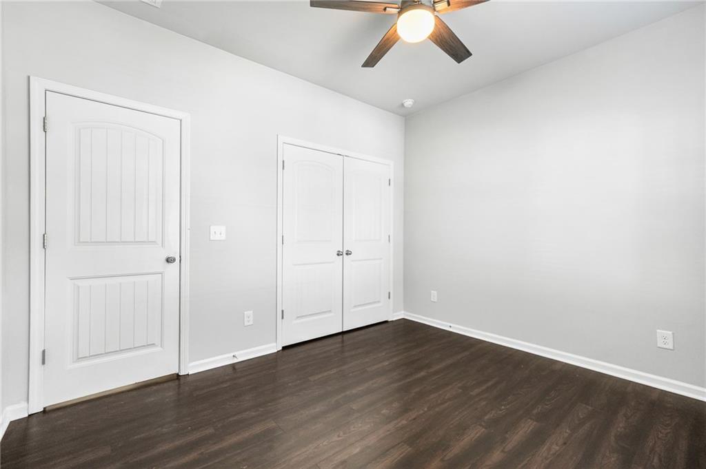 200 Cherokee Reserve Circle Canton, GA 30115 - Photo 39 of 50 a view of an empty room with wooden floor