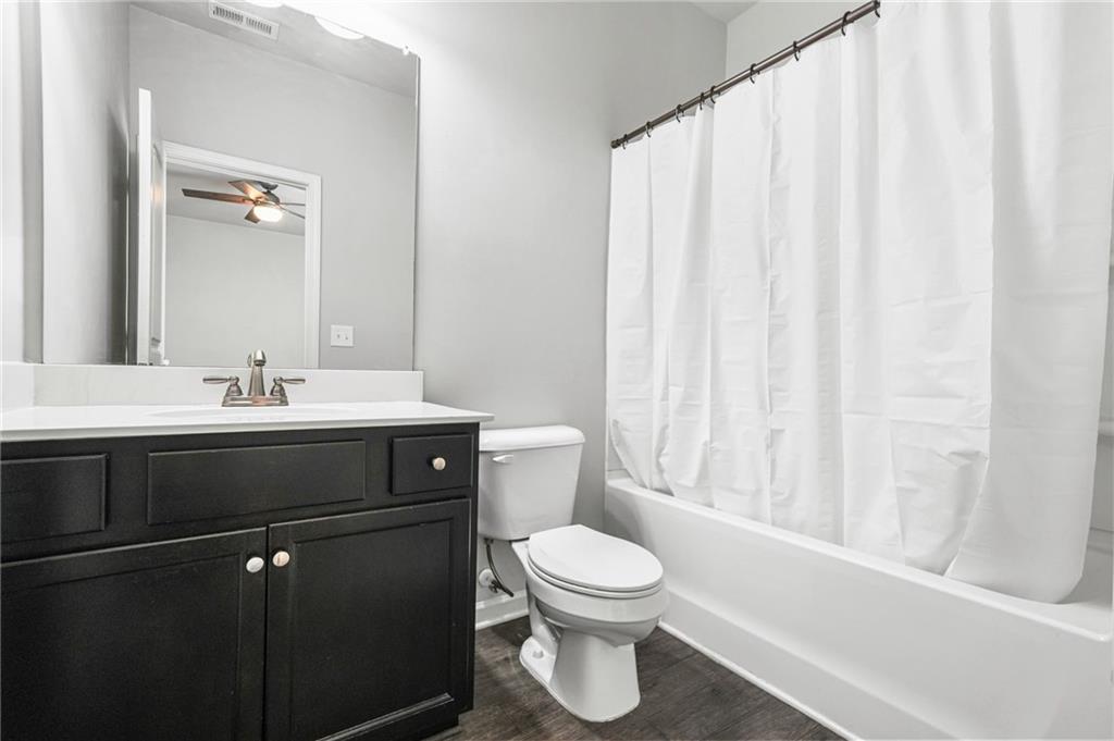 200 Cherokee Reserve Circle Canton, GA 30115 - Photo 47 of 50 a bathroom with a sink a toilet and shower