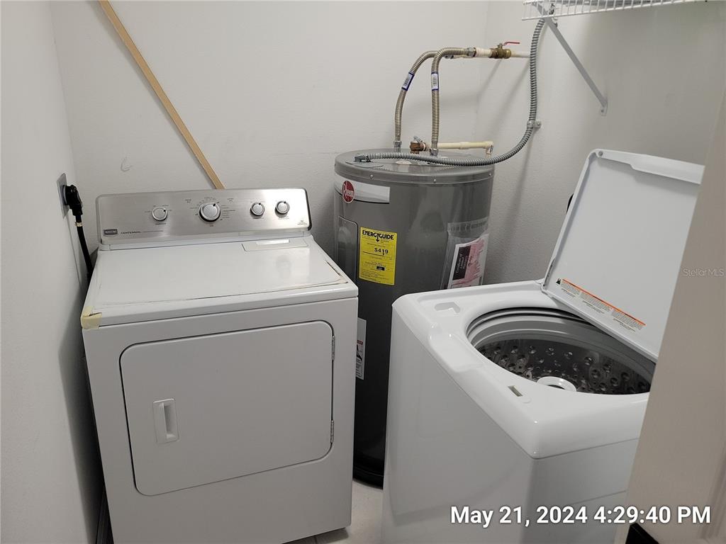 1013 Apollo Beach Boulevard, Unit 101 Apollo Beach, FL 33572 - Photo 14 of 19 a utility room with dryer and washer