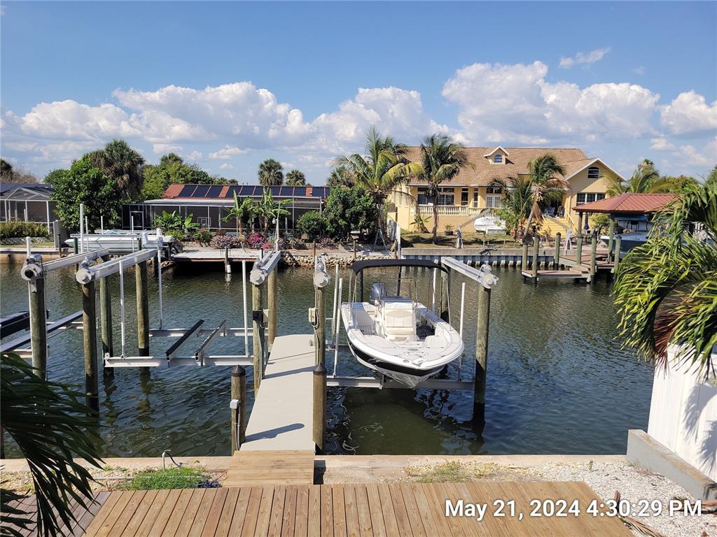 1013 Apollo Beach Boulevard, Unit 101 Apollo Beach, FL 33572 - Photo 18 of 19 a view of a lake with a house