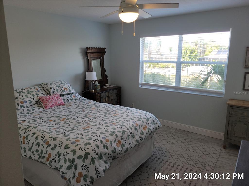 1013 Apollo Beach Boulevard, Unit 101 Apollo Beach, FL 33572 - Photo 7 of 19 a bedroom with a bed and a window