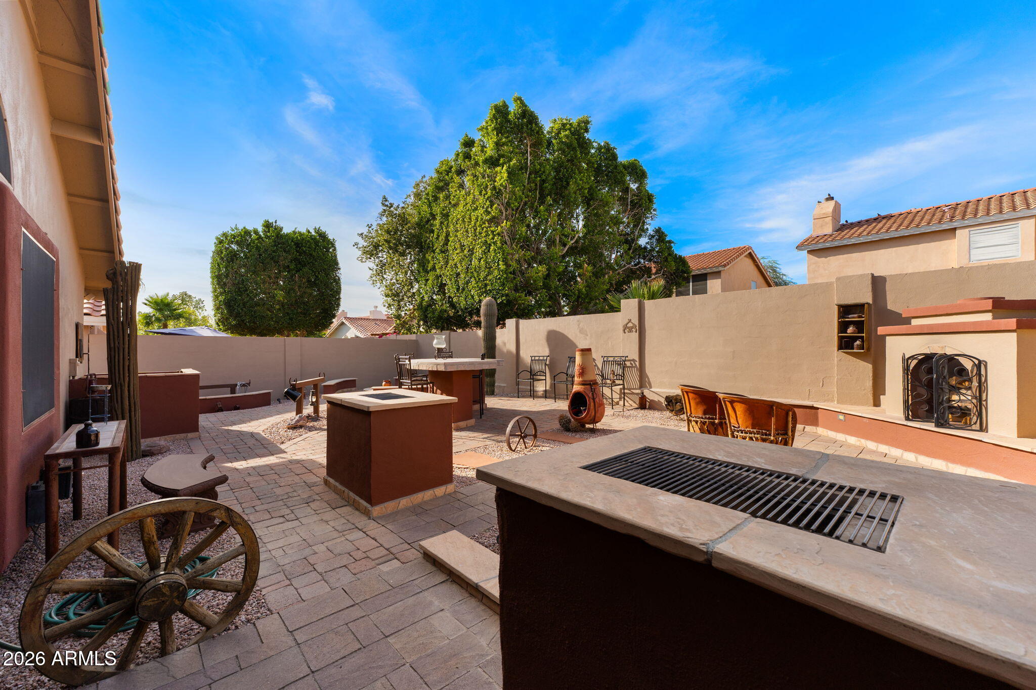 6526 East Raftriver Street Mesa, AZ 85215 - Photo 13 of 17 a view of a patio with couches and potted plants