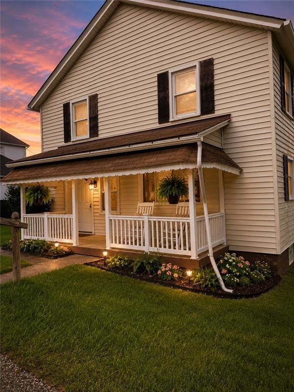 a view of a house with a yard and deck