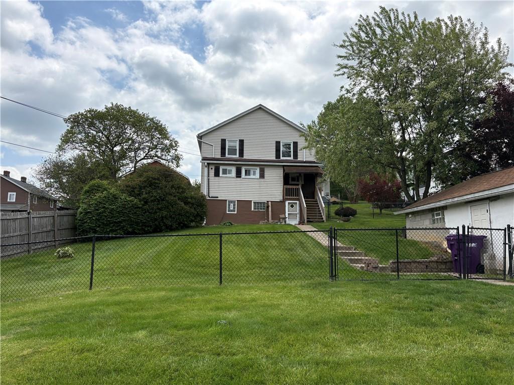 9155 Maple Street Pittsburgh, PA 15239 - Photo 11 of 16 a house view with a garden space