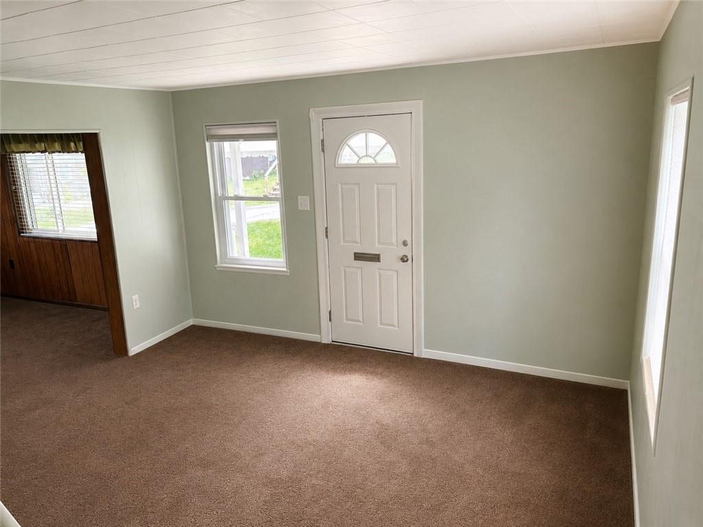 9155 Maple Street Pittsburgh, PA 15239 - Photo 3 of 16 an empty room with windows and closet