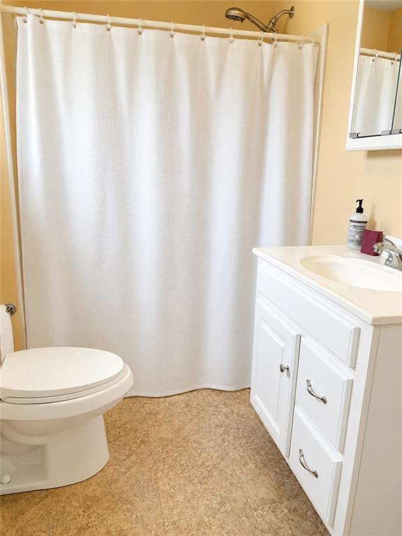 9155 Maple Street Pittsburgh, PA 15239 - Photo 4 of 16 a bathroom with a sink and a toilet