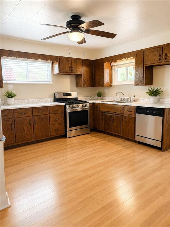 9155 Maple Street Pittsburgh, PA 15239 - Photo 5 of 16 a large kitchen with stainless steel appliances granite countertop a sink and cabinets