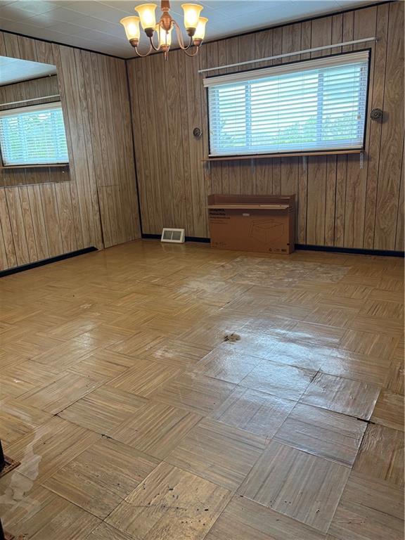 9155 Maple Street Pittsburgh, PA 15239 - Photo 8 of 16 a view of a room with wooden walls and windows