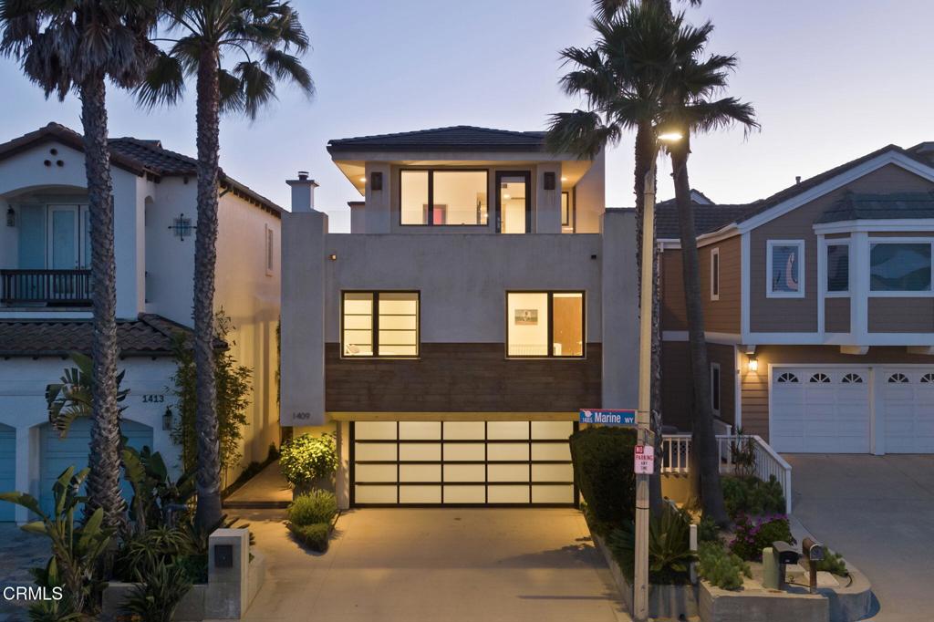 1409 Marine Way Oxnard, CA 93035 - Photo 1 of 58 a front view of a house with a garden