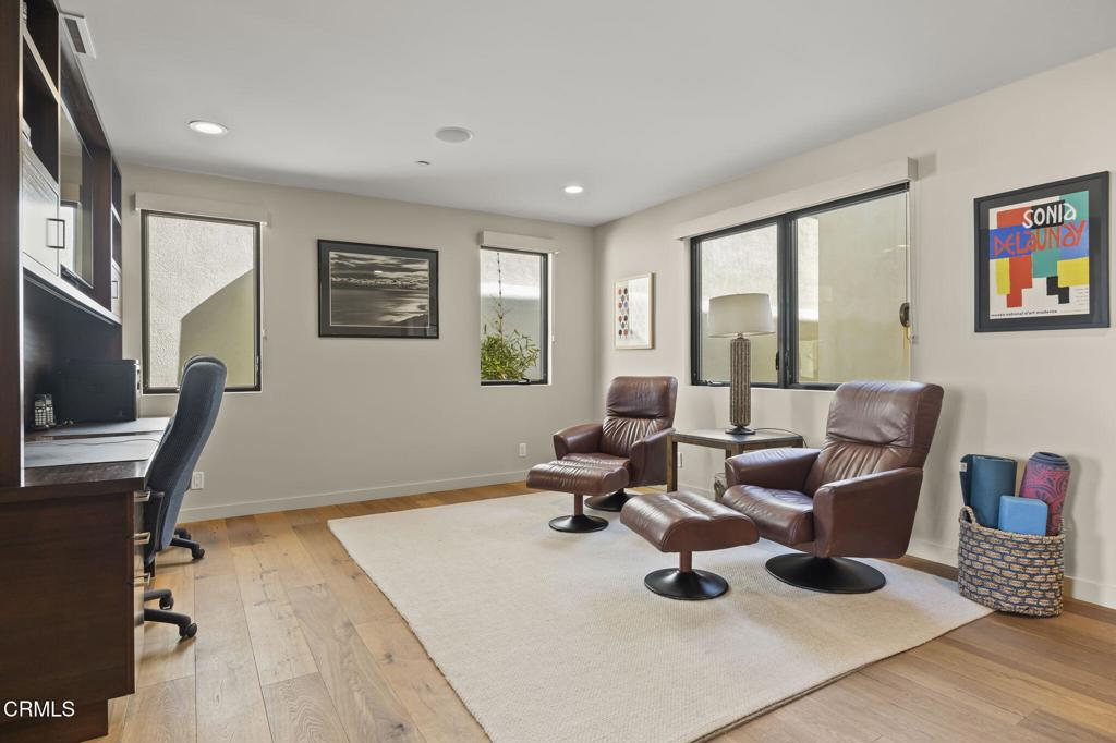 1409 Marine Way Oxnard, CA 93035 - Photo 22 of 58 a living room with furniture wooden floor and a flat screen tv