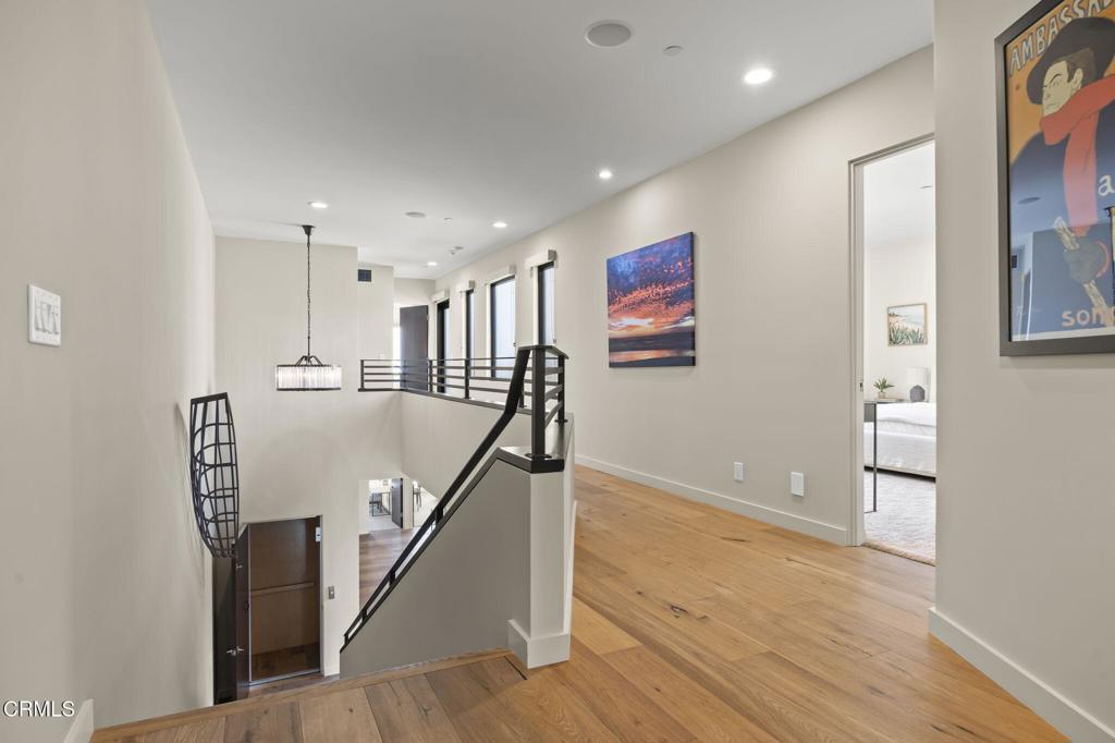 1409 Marine Way Oxnard, CA 93035 - Photo 26 of 58 a view of a hallway with wooden floor and staircase
