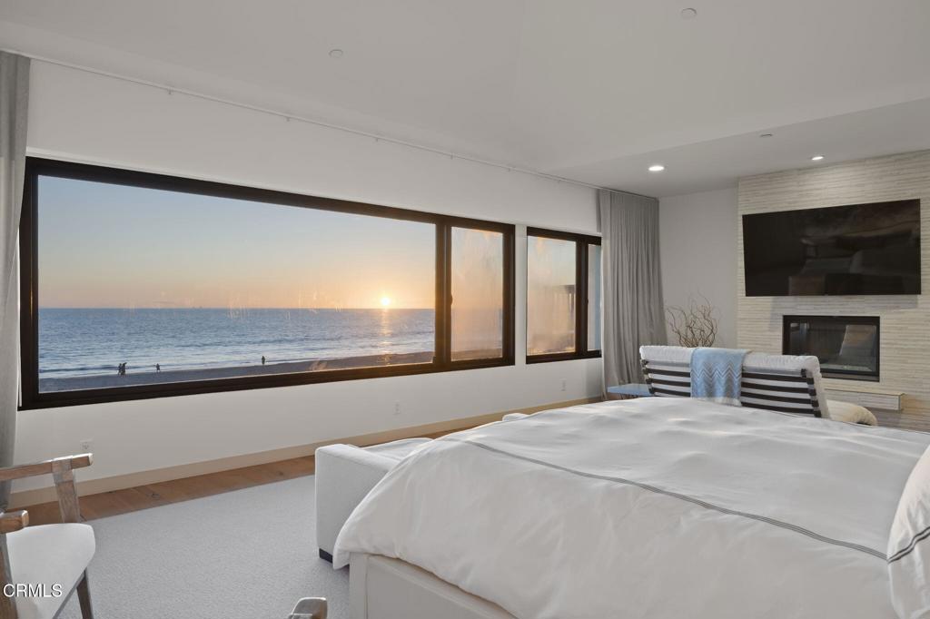 1409 Marine Way Oxnard, CA 93035 - Photo 27 of 58 a bedroom with a large bed and a flat screen tv