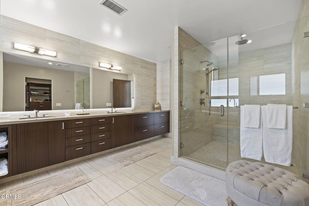1409 Marine Way Oxnard, CA 93035 - Photo 31 of 58 a bathroom with a granite countertop sink mirror and shower