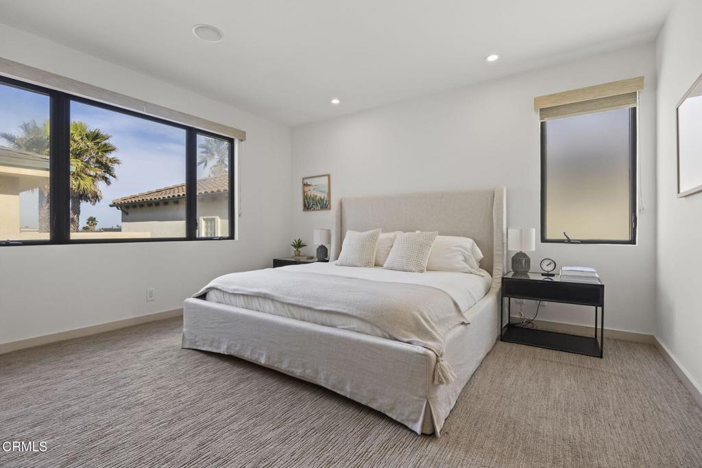 1409 Marine Way Oxnard, CA 93035 - Photo 39 of 58 a bedroom with a bed and painting on the wall