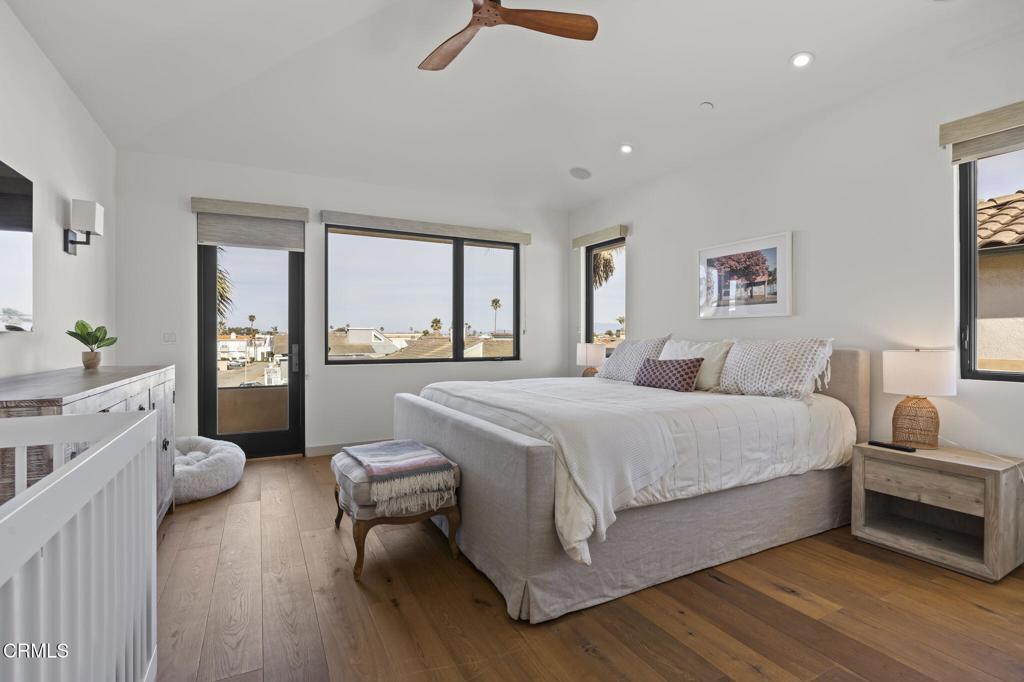 1409 Marine Way Oxnard, CA 93035 - Photo 41 of 58 a spacious bedroom with a bed and a large window