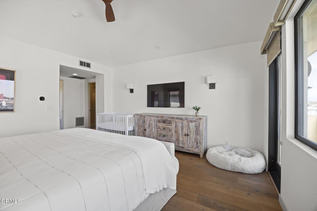 1409 Marine Way Oxnard, CA 93035 - Photo 42 of 58 a bedroom with a bed and a flat screen tv