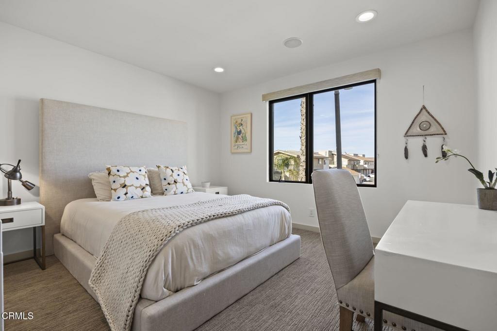1409 Marine Way Oxnard, CA 93035 - Photo 46 of 58 a bedroom with a bed and a table