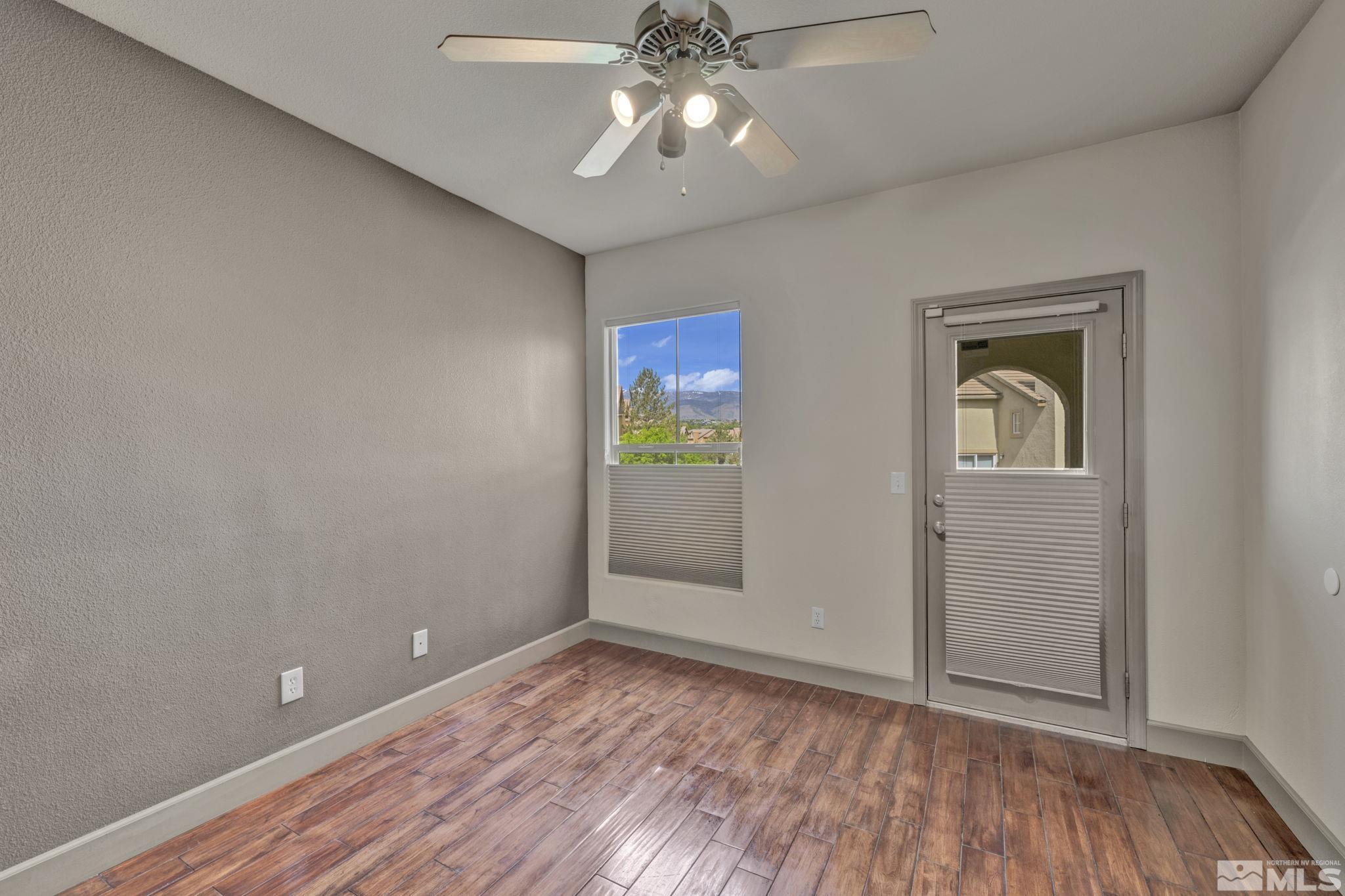 17000 Wedge Parkway, Unit 3422 Reno, NV 89511 - Photo 15 of 39 wooden floor in an empty room with a window