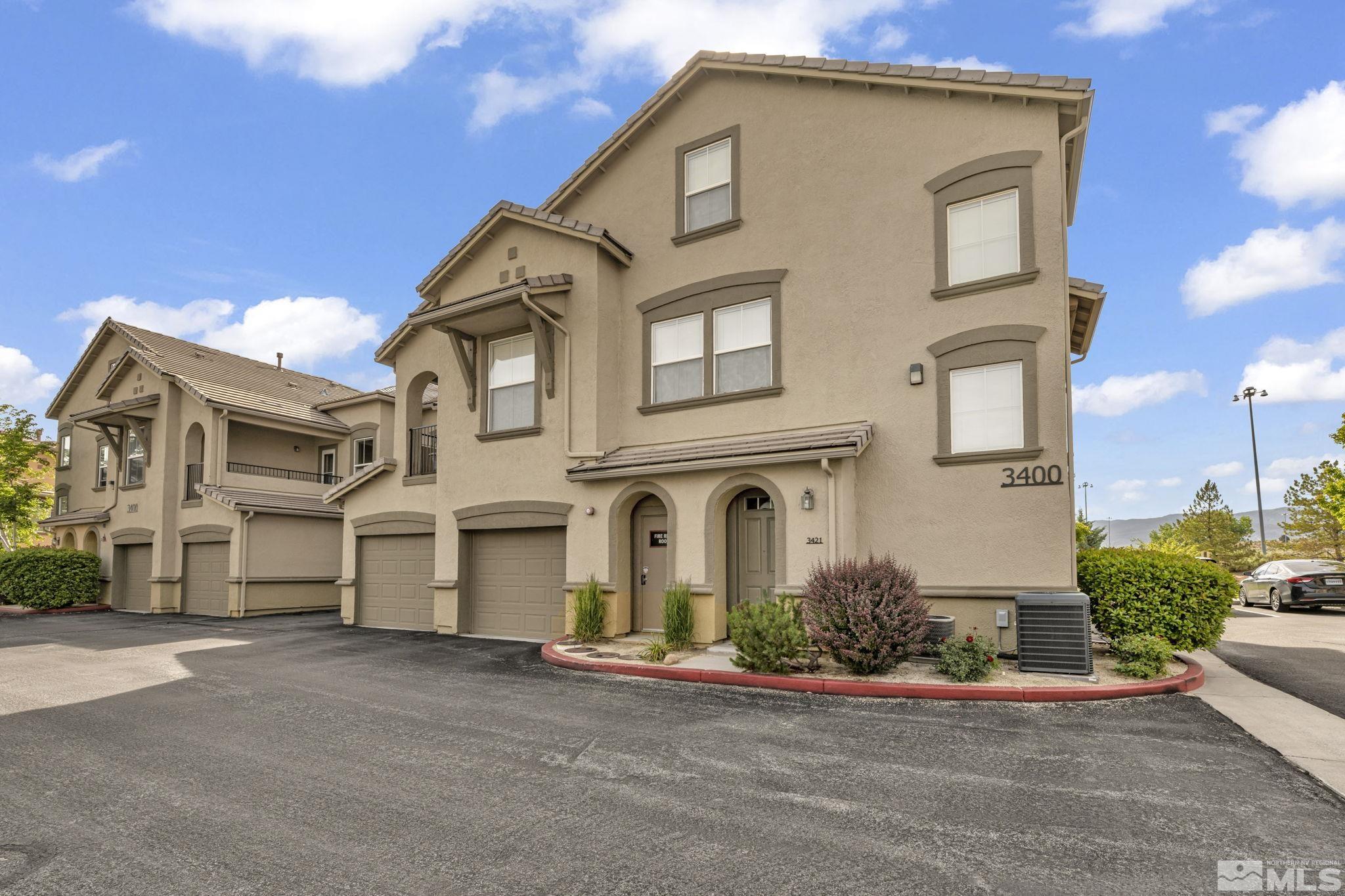 17000 Wedge Parkway, Unit 3422 Reno, NV 89511 - Photo 33 of 39 a front view of a house with a yard