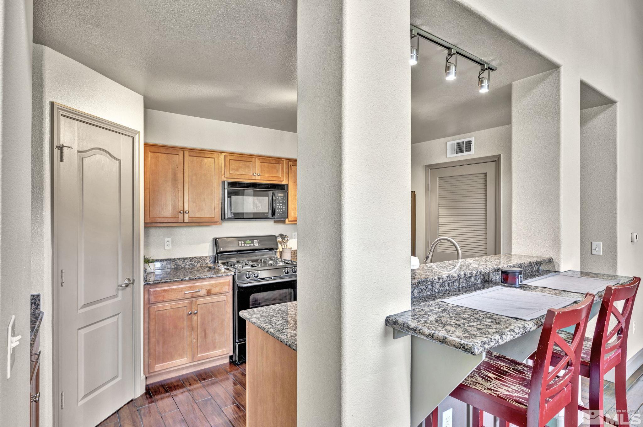 17000 Wedge Parkway, Unit 3422 Reno, NV 89511 - Photo 4 of 39 a kitchen with stainless steel appliances granite countertop a sink stove and refrigerator