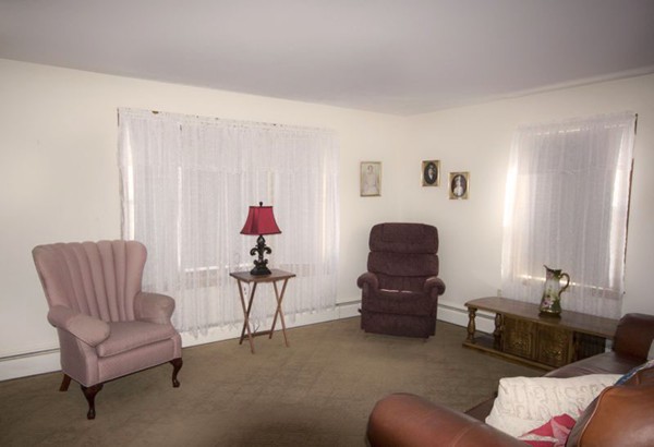 1 Whitcomb Road East Providence, RI 02915 - Photo 2 of 9 a living room with furniture and a potted plant