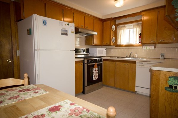 1 Whitcomb Road East Providence, RI 02915 - Photo 3 of 9 a kitchen with a sink a stove and refrigerator
