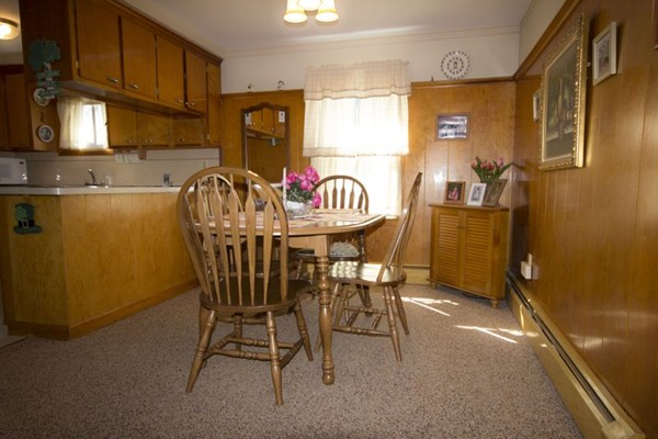 1 Whitcomb Road East Providence, RI 02915 - Photo 4 of 9 a view of a dining room with furniture and a chandelier