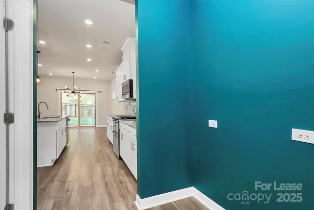 a view of hallway with a large window