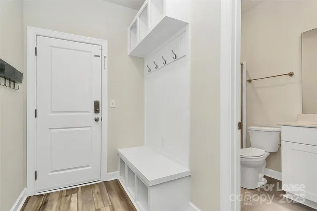 a bathroom with a toilet and a shower