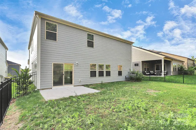 a view of a house with a yard and garden
