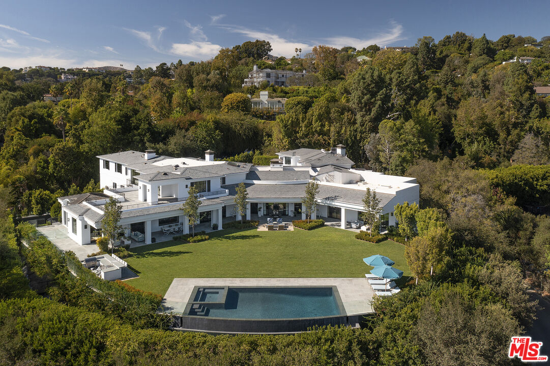 10771 Bellagio Road Los Angeles, CA 90077 - Photo 2 of 2 a view of a house with a yard