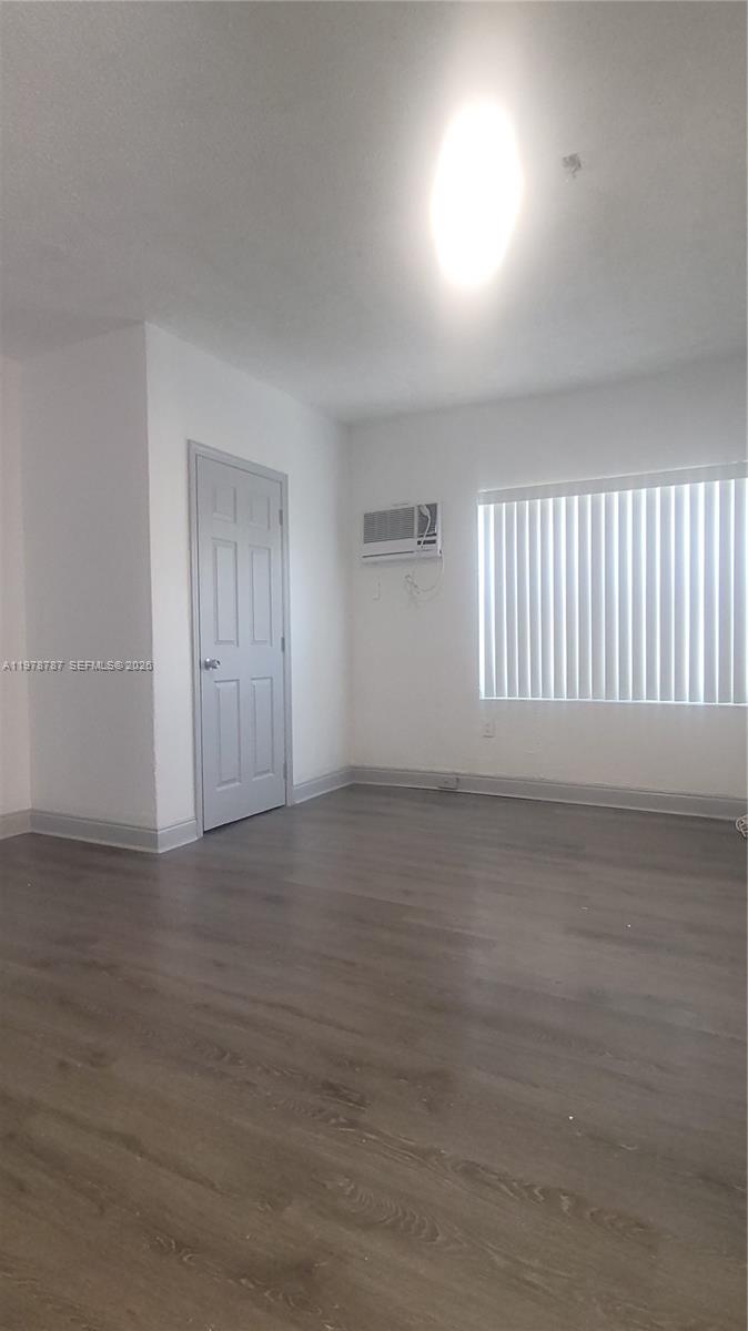 1322 Southwest 7th Street, Unit 4 Miami, FL 33135 - Photo 3 of 15 a view of an empty room with a window