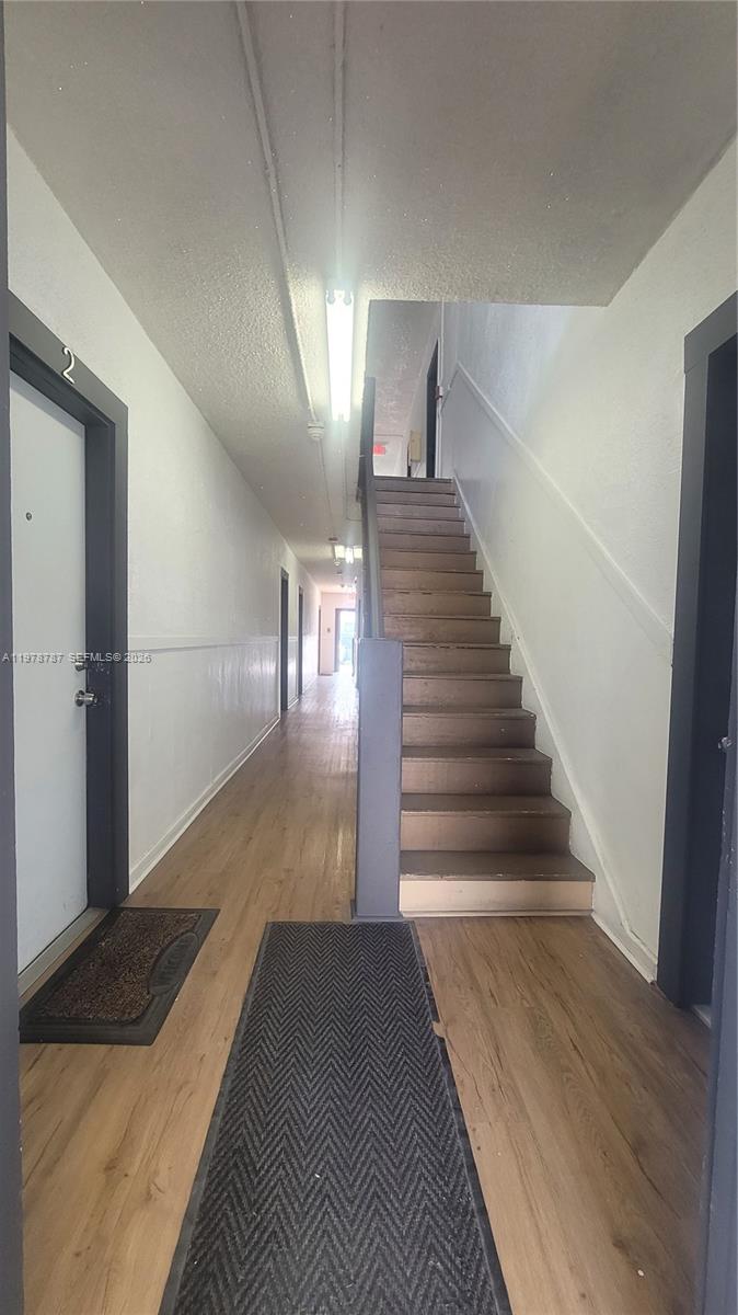 1322 Southwest 7th Street, Unit 4 Miami, FL 33135 - Photo 4 of 15 a view of entryway and hall with wooden floor