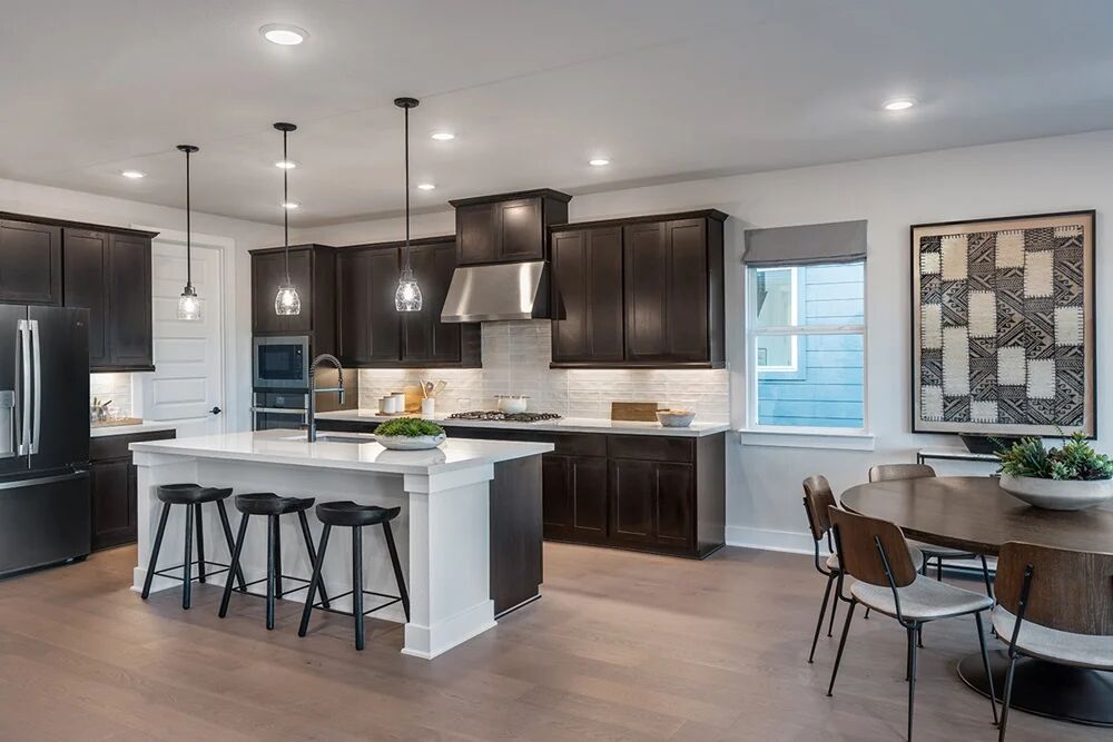 9504 Hamadryas Drive Austin, TX 78744 - Photo 5 of 23 a large kitchen with a table and chairs