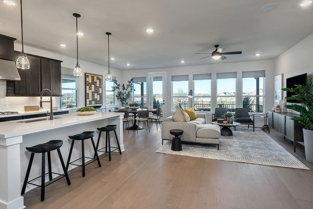 9504 Hamadryas Drive Austin, TX 78744 - Photo 6 of 23 a living room with furniture a flat screen tv and a large window