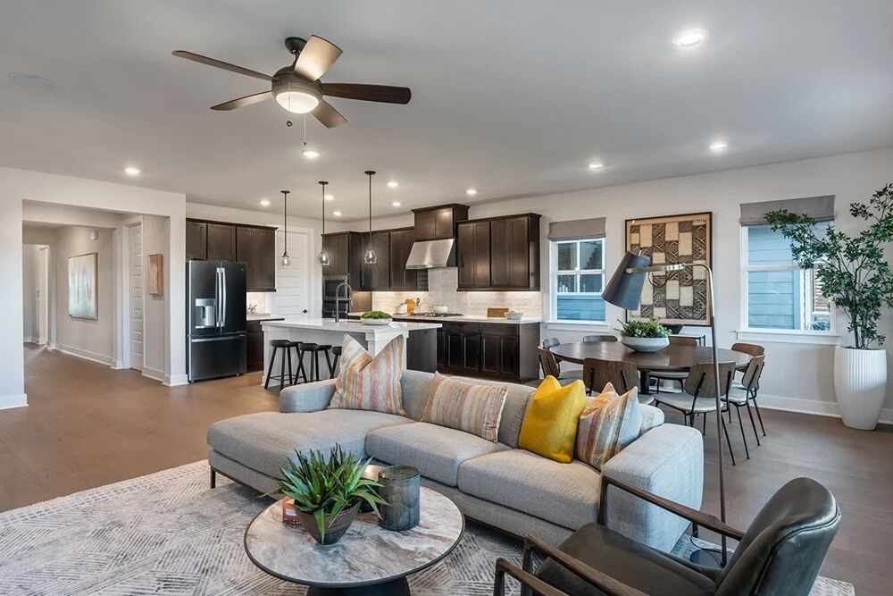 9504 Hamadryas Drive Austin, TX 78744 - Photo 8 of 23 a living room with furniture kitchen view and a chandelier
