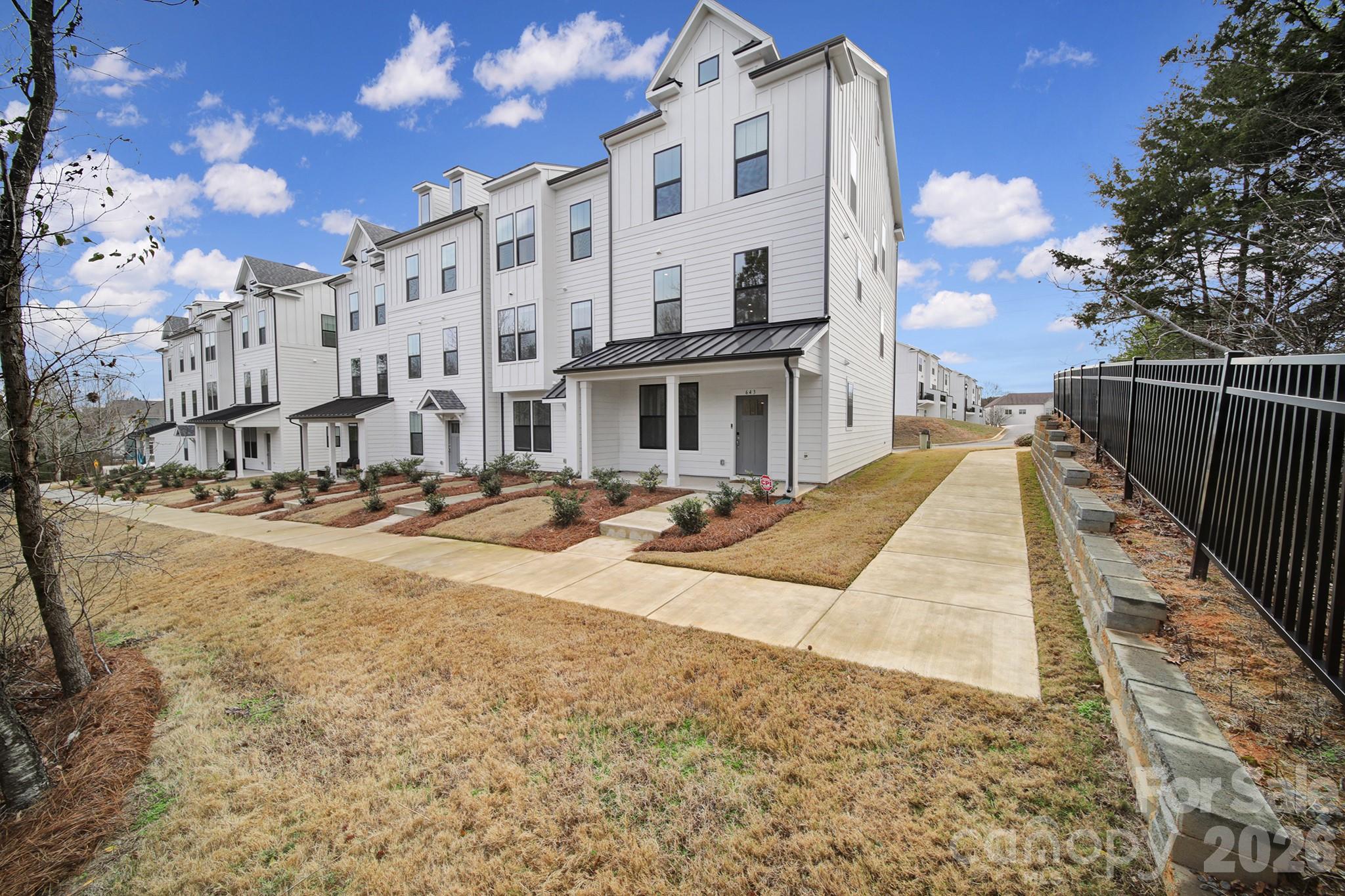 a view of a building with a yard