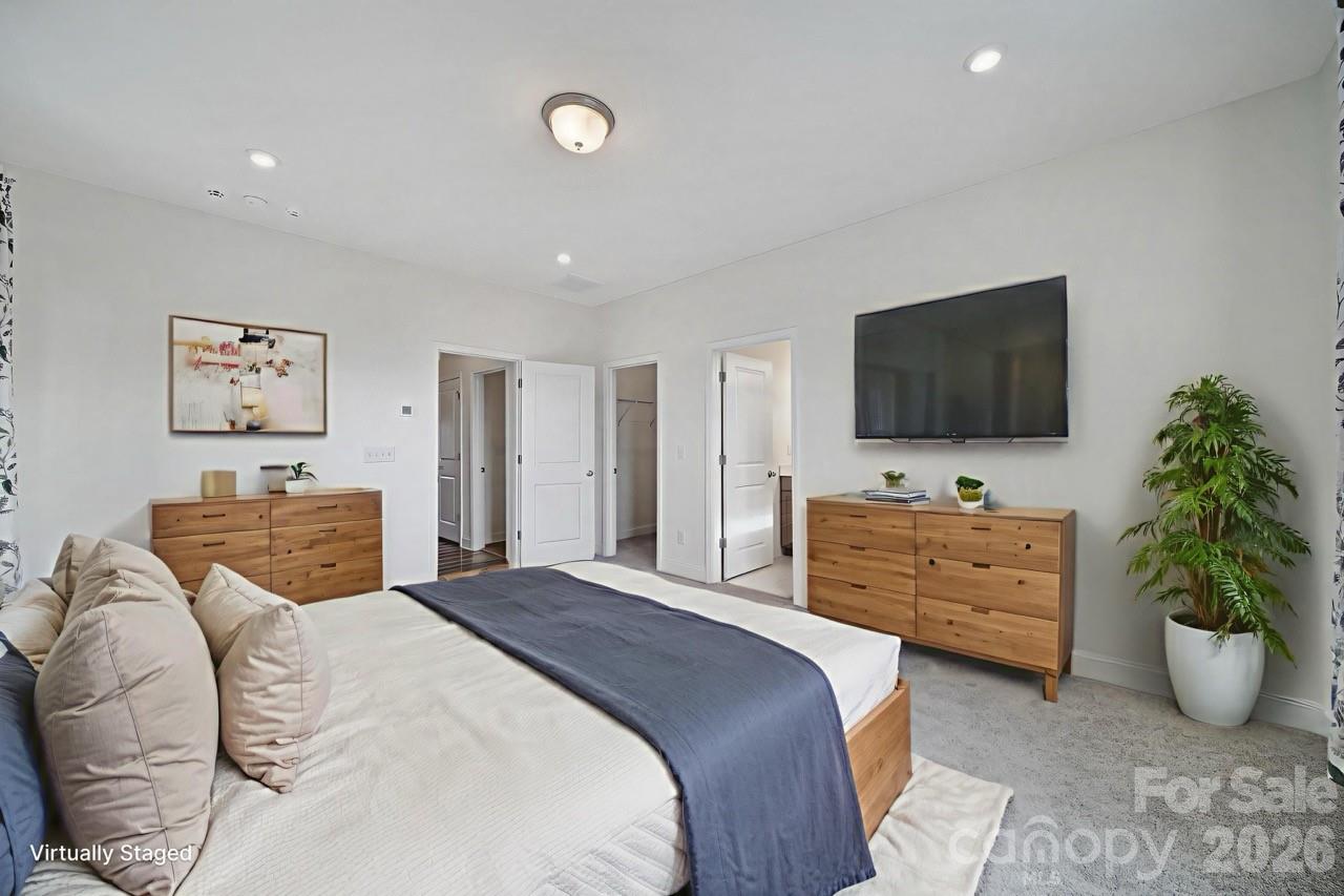 643 District Court Fort Mill, SC 29708 - Photo 20 of 41 a bedroom with a bed and flat screen tv