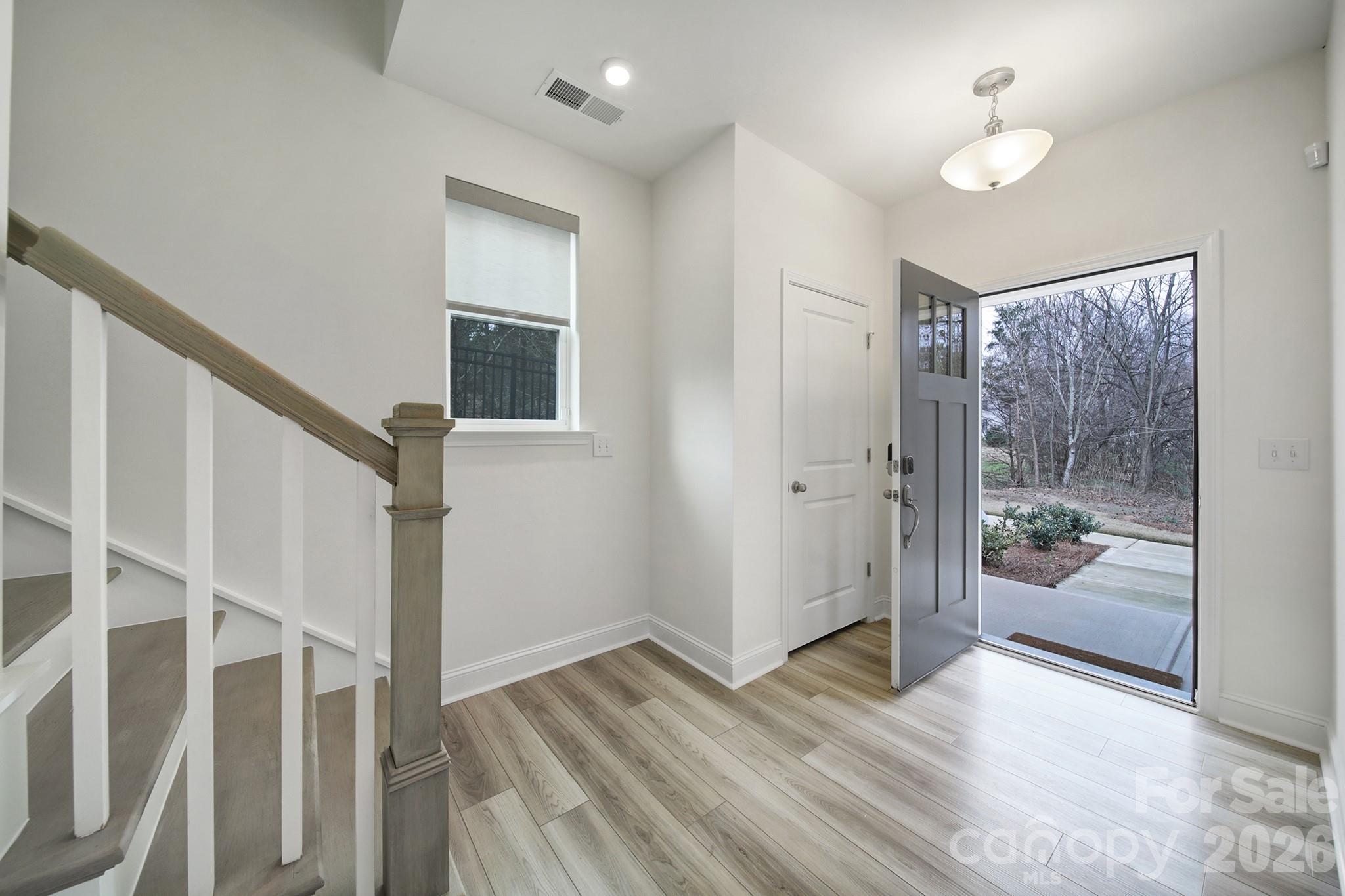 643 District Court Fort Mill, SC 29708 - Photo 4 of 41 a view of entryway with wooden floor and bedroom view