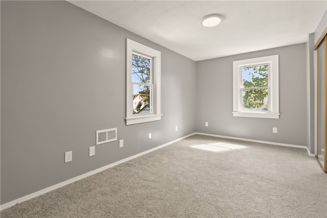 67 Harwick Road Irondequoit, NY 14609 - Photo 19 of 33 Bedroom #2 featuring brand new carpet & vinyl windows