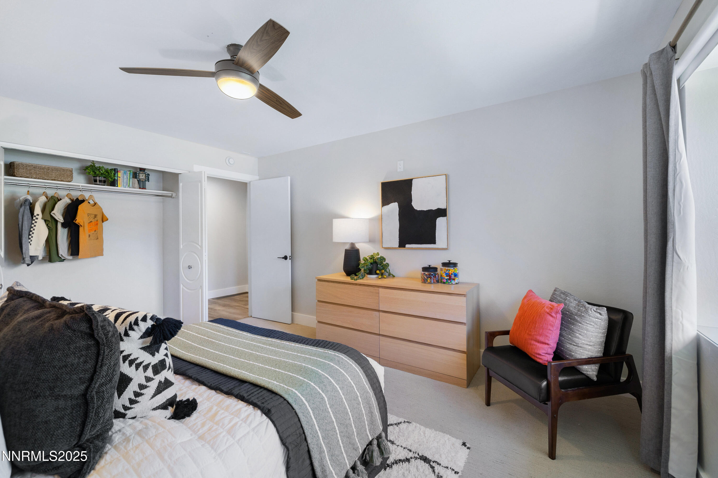 1401 Monroe Street Reno, NV 89509 - Photo 22 of 43 a bedroom with a bed and a chair