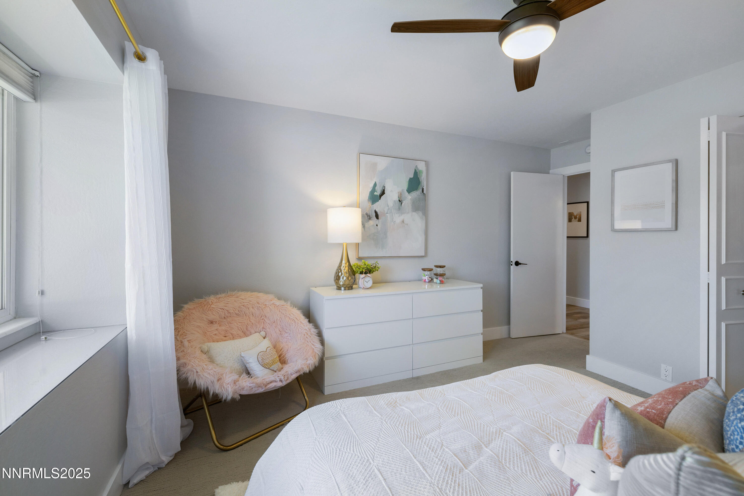 1401 Monroe Street Reno, NV 89509 - Photo 25 of 43 a bedroom with a bed and a chandelier
