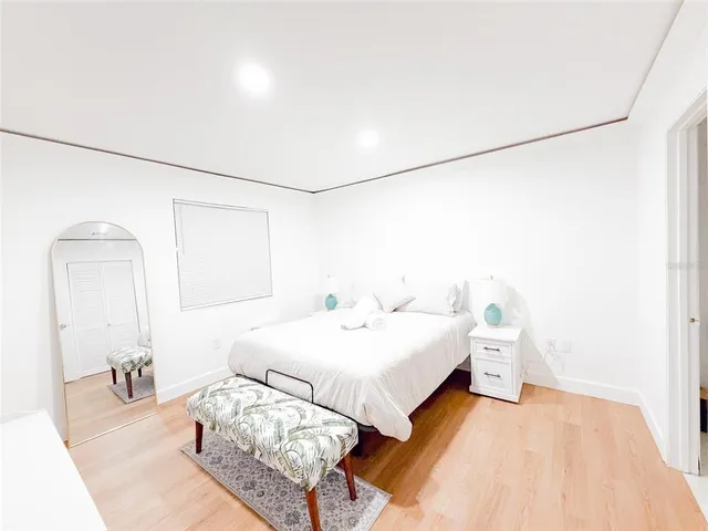 a bedroom with a bed and a table