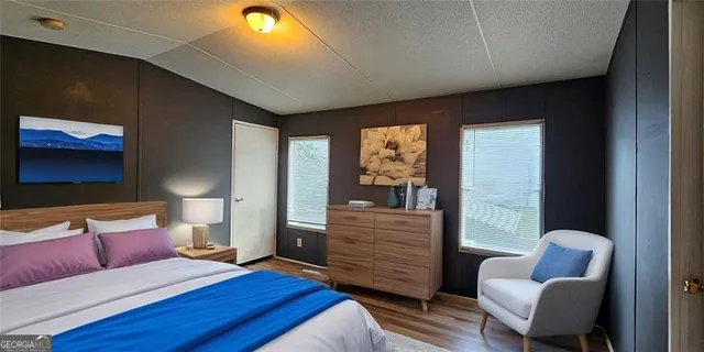 a bedroom with a bed and a couch