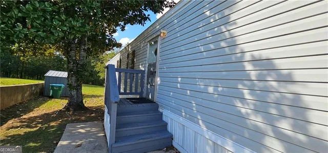 a view of a patio with wooden floor