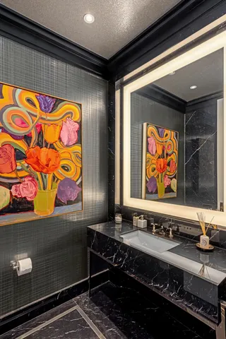 a bathroom with a sink and a mirror