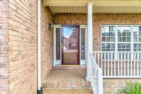 a view of a door with a door and a window