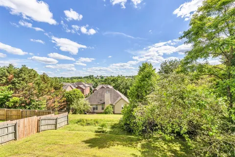 a view of a swimming pool with a yard