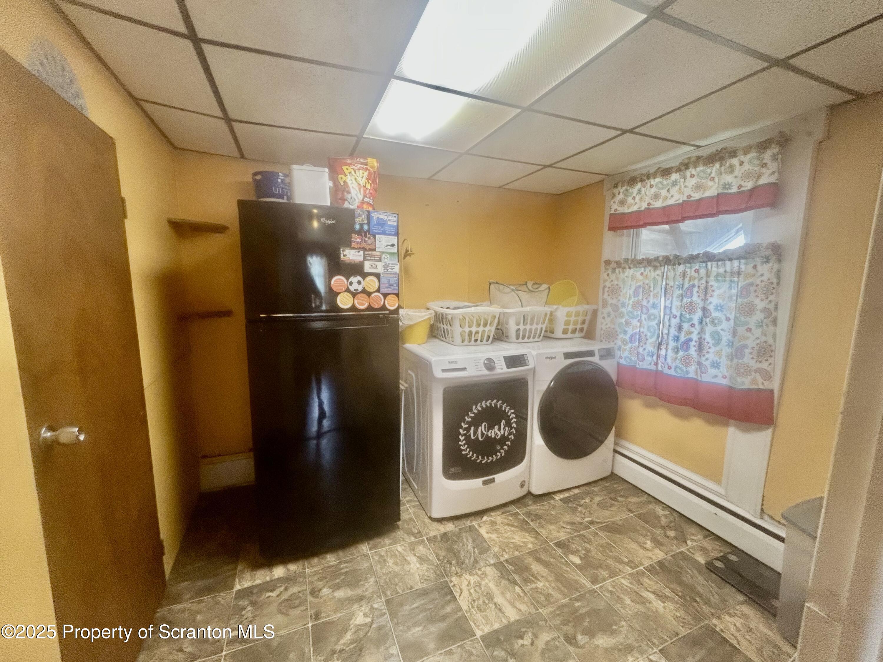 536 Old Rte 11 New Milford, PA 18834 - Photo 11 of 36 a utility room with dryer and washer