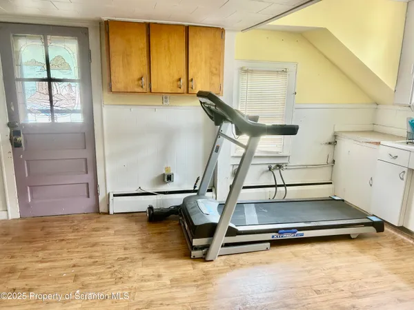 a kitchen with a stove a sink and a refrigerator